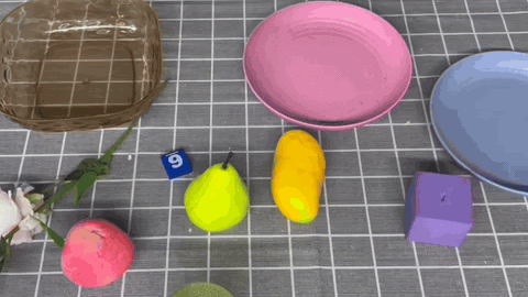 Put the mango into the transparent plate demo.
